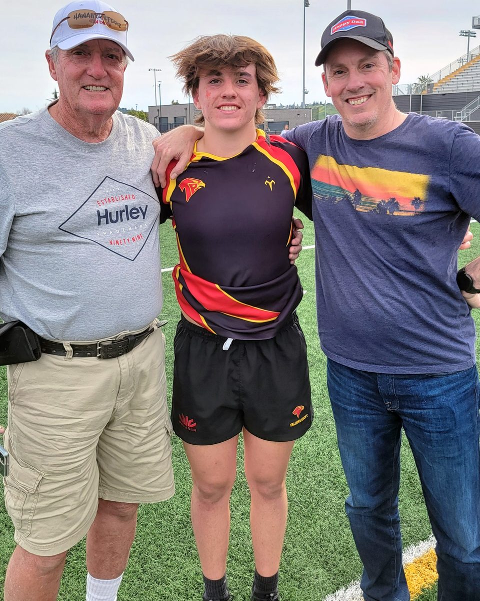 Ryan in his Torrey Pines kit between his grandfather and Jason