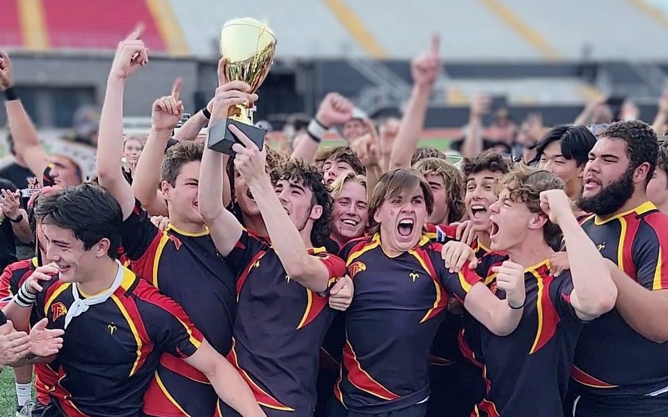 Torrey Pines players lifting the state championship trophy